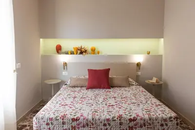 Letto o letti in una camera di Central House palazzo Brafa una camera di albergo