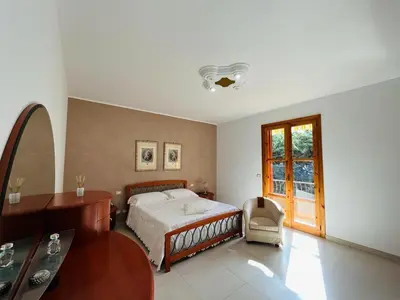 Letto o letti in una camera di Casa Manila