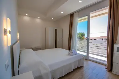 Letto o letti in una camera di Charming House Sveleo - SiciliaVacanza