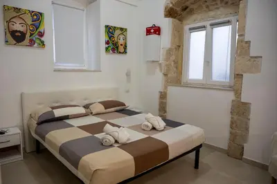 Letto o letti in una camera di Kalsa’s House Noto