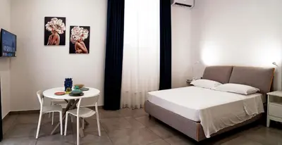 Letto o letti in una camera di LA PETITE SUITE SAN GIULIANO