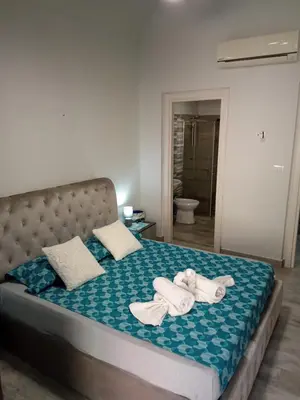 Letto o letti in una camera di BonaHouse