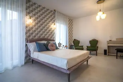 Letto o letti in una camera di Maiolica Rooms