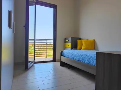 Letto o letti in una camera di Siracusa Suite, AC + Wi-Fi + Free Private Parking