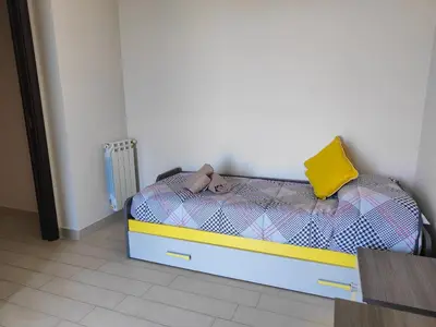 Letto o letti in una camera di Siracusa Suite, AC + Wi-Fi + Free Private Parking