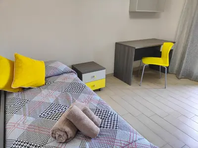 Letto o letti in una camera di Siracusa Suite, AC + Wi-Fi + Free Private Parking