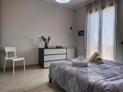 Letto o letti in una camera di Siracusa Suite, AC + Wi-Fi + Free Private Parking