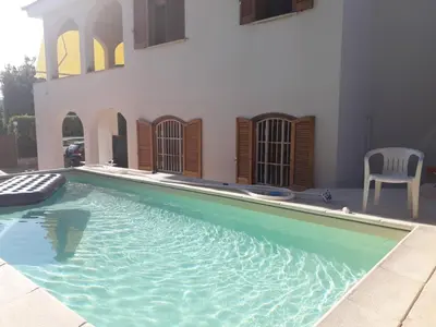 Piscina di Apartment in villa with swimming pool 20 meters from the sea o nelle vicinanze
