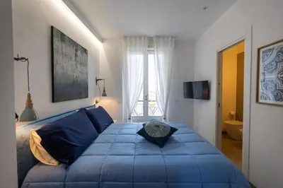 Letto o letti in una camera di Central house palazzo brafa appartamento 5