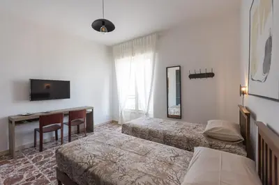 Letto o letti in una camera di Central house palazzo brafa appartamento 5