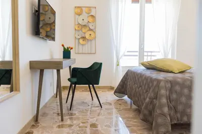 Letto o letti in una camera di Central house palazzo brafa appartamento 5