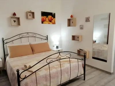 Letto o letti in una camera di Rosso Moro
