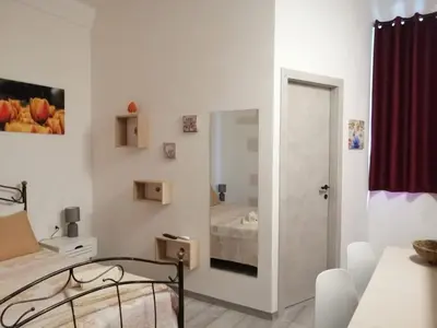 Letto o letti in una camera di Rosso Moro