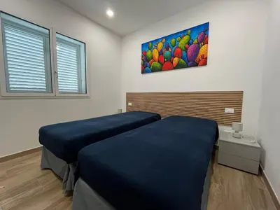 Letto o letti in una camera di Villa Eraklea