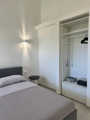 Letto o letti in una camera di Villa Giuliana Luxury Home: piscina, solarium, barbecue. A pochi passi dal mare