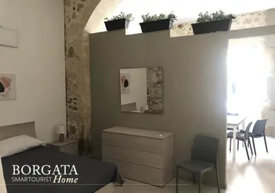 Area soggiorno di Borgata Home - Casa Vacanza Siracusa