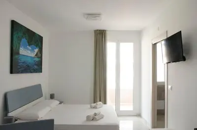 Letto o letti in una camera di Panta Rei Charme Suite - 5 min from the sea