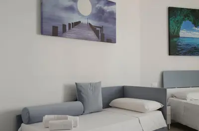 Letto o letti in una camera di Panta Rei Charme Suite - 5 min from the sea