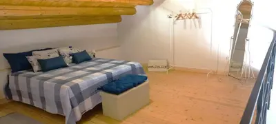 Letto o letti in una camera di ALMADEMARI GIGLIO CASA VACANZA