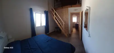 Letto o letti in una camera di ALMADEMARI GIGLIO CASA VACANZA