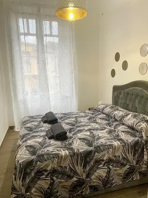 Letto o letti in una camera di Global center Catania