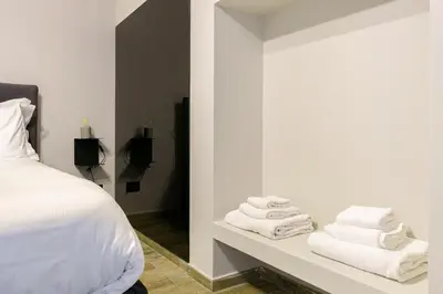 Letto o letti in una camera di VICOLO SAN GAETANO -luxury rooms-