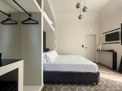 Letto o letti in una camera di VICOLO SAN GAETANO -luxury rooms-