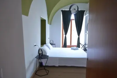 Letto o letti in una camera di Casa Dante
