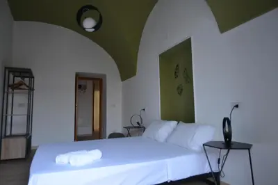 Letto o letti in una camera di Casa Dante