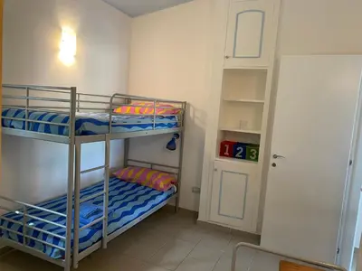 Letto o letti in una camera di Villa Titti Residence la Bussola