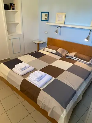 Letto o letti in una camera di Villa Titti Residence la Bussola