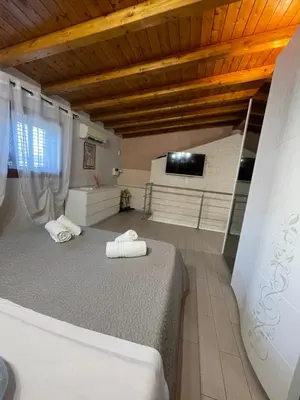 Letto o letti in una camera di OTTO SUITE