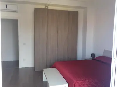 Letto o letti in una camera di Casa Alessandra