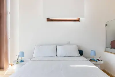 Letto o letti in una camera di Casa di Viola - SeaView in the Heart of Catania - Romantic Apt for 2 guests