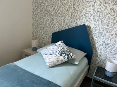 Letto o letti in una camera di Casa Azzurra