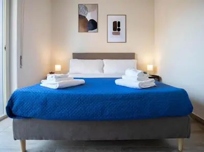 Letto o letti in una camera di My Home Catania Rooms