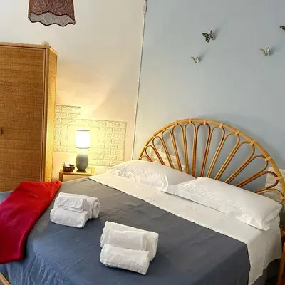 Letto o letti in una camera di L' APPARTAMENTO sul MARE