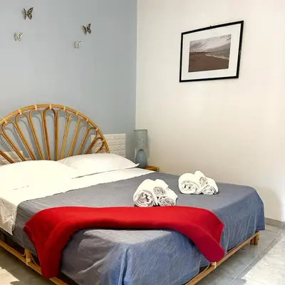 Letto o letti in una camera di L' APPARTAMENTO sul MARE