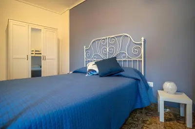 Letto o letti in una camera di Maiolica Rooms Appartamento Ragusa Ibla