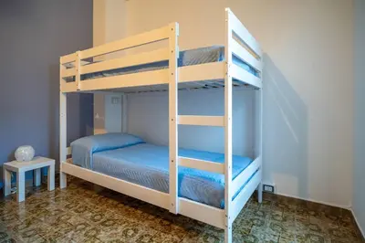 Letto o letti in una camera di Maiolica Rooms Appartamento Ragusa Ibla