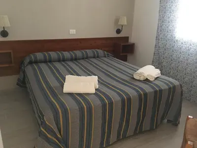 Letto o letti in una camera di Forte Village