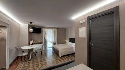 Letto o letti in una camera di I 3 Principi, Garibaldi Suites