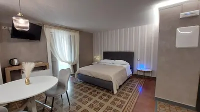 Letto o letti in una camera di I 3 Principi, Garibaldi Suites