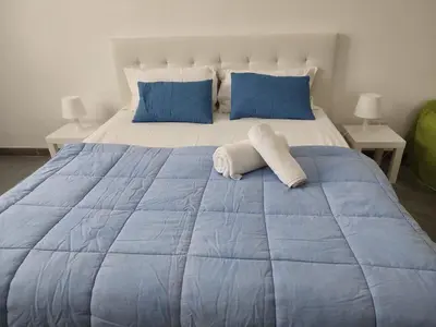 Letto o letti in una camera di Villa Isabella