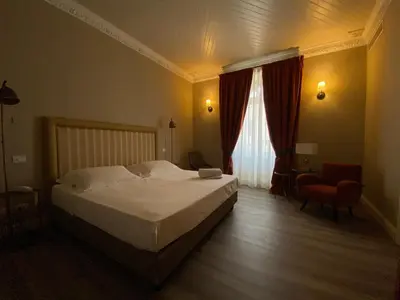 Letto o letti in una camera di Lanterne Magiche Ortigia Suites