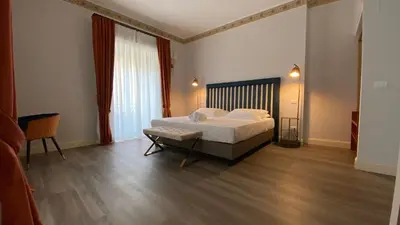 Letto o letti in una camera di Lanterne Magiche Ortigia Suites