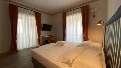 Letto o letti in una camera di Lanterne Magiche Ortigia Suites