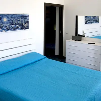 Letto o letti in una camera di Villa Amateia