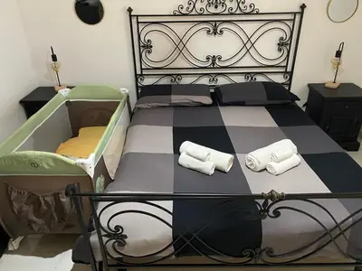 Letto o letti in una camera di Belvedere House Holiday Siracusa Ortigia