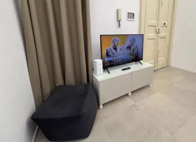 TV o dispositivi per l'intrattenimento presso Martiry Suite Apartment